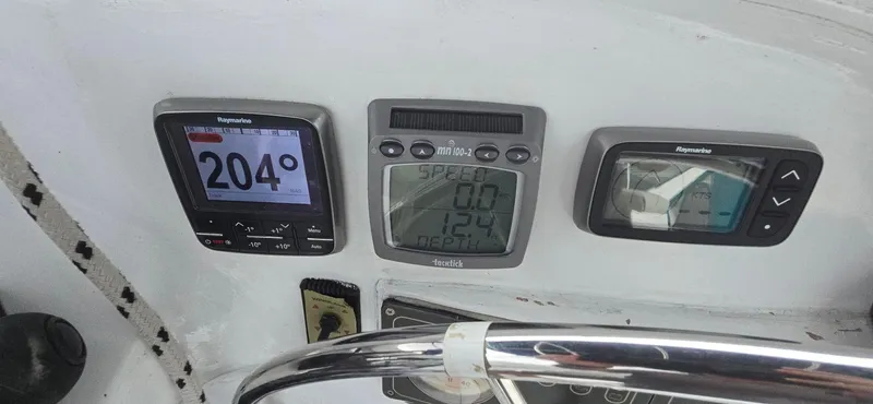 Bellagio Yacht Photos Pics Instrument panel on 2013 Kelsall Suncat 40 showing navigation and speed data.