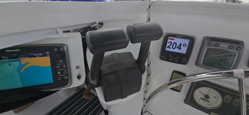 Bellagio Yacht Photos Pics Cockpit controls of 2013 Kelsall Suncat 40 with navigation and throttle systems.