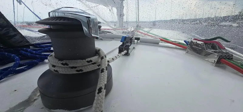 Bellagio Yacht Photos Pics Winch and ropes on 2013 Kelsall Suncat 40 sailboat deck in rainy weather.