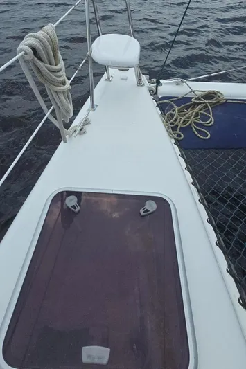 Bellagio Yacht Photos Pics 2013 Kelsall Suncat 40 yacht deck with ropes and hatch, sailing on open water.