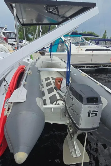 Bellagio Yacht Photos Pics Kelsall Suncat 40 (2013) with inflatable boat and outboard motor at marina.