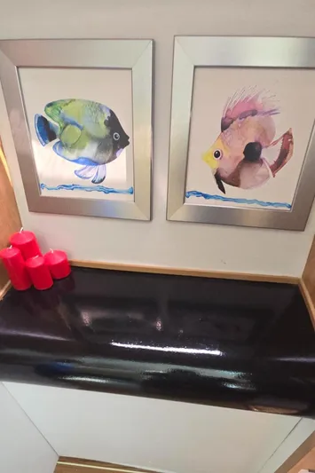 Bellagio Yacht Photos Pics Framed fish art and red candles on a Kelsall Suncat 40, 2013 model.