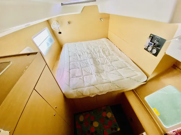 Finally Found Yacht Photos Pics Cozy cabin interior of 2014 Lagoon 380 S2 catamaran with bed and storage.