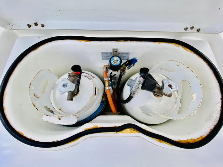 Finally Found Yacht Photos Pics Two propane tanks in a storage compartment on a 2014 Lagoon 380 S2 catamaran.