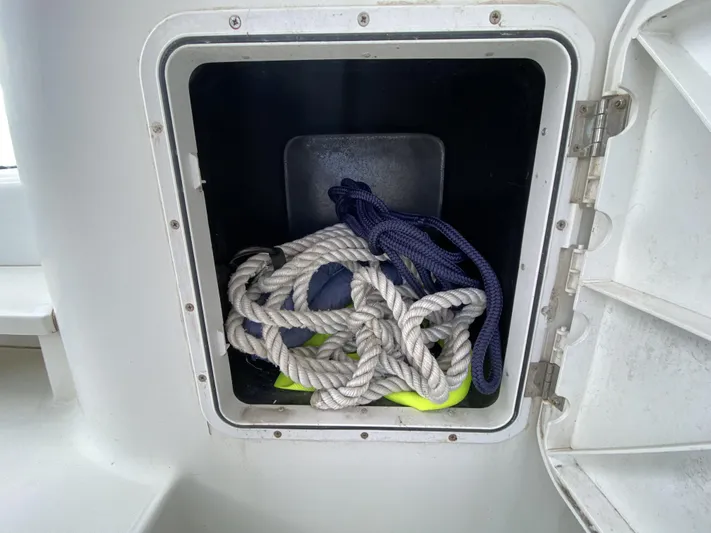 Finally Found Yacht Photos Pics Storage compartment on a 2014 Lagoon 380 S2 with coiled ropes inside.