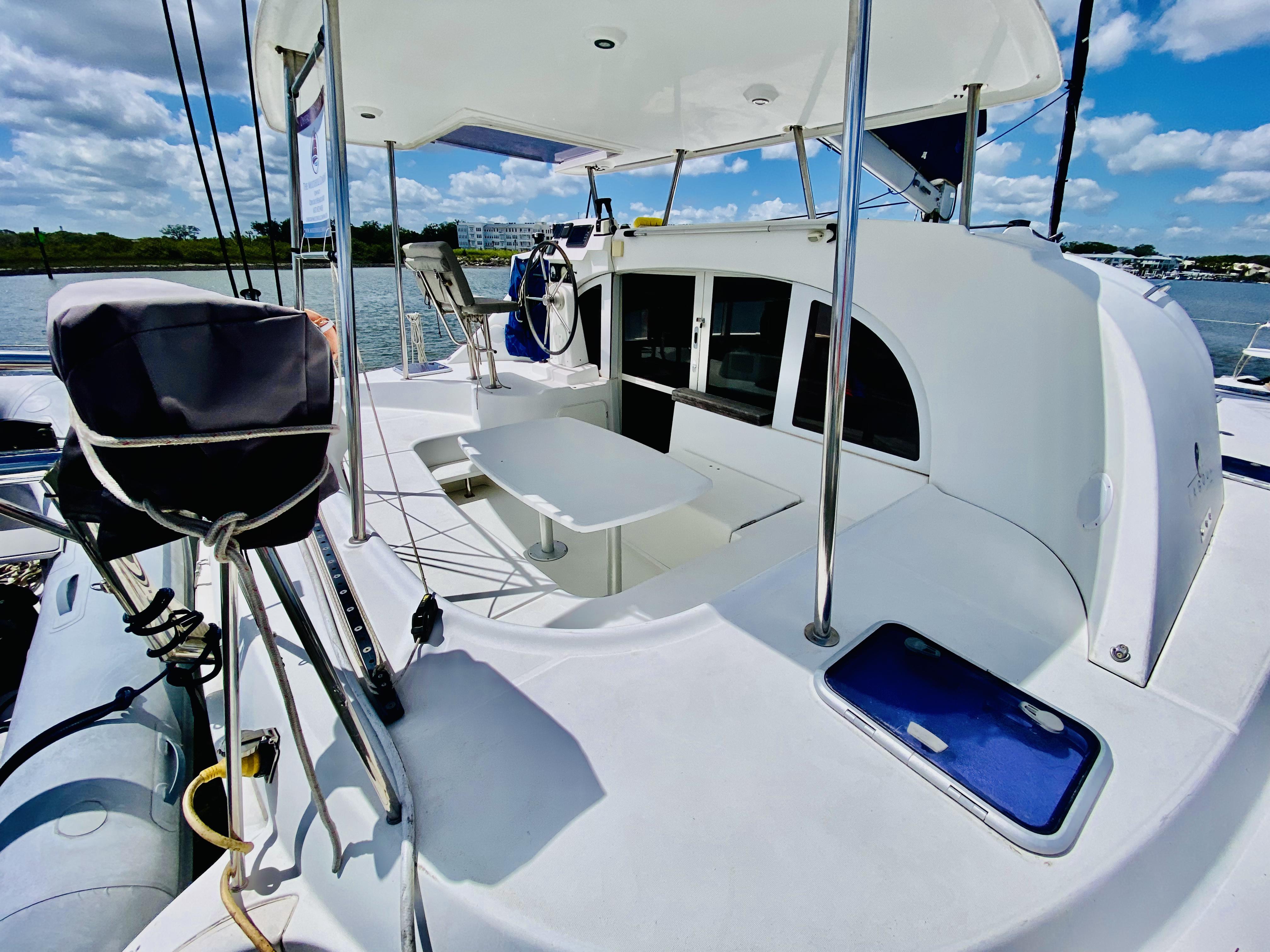 Lagoon 380 S2 catamaran, 2014 model, featuring spacious deck and modern design on a sunny day.