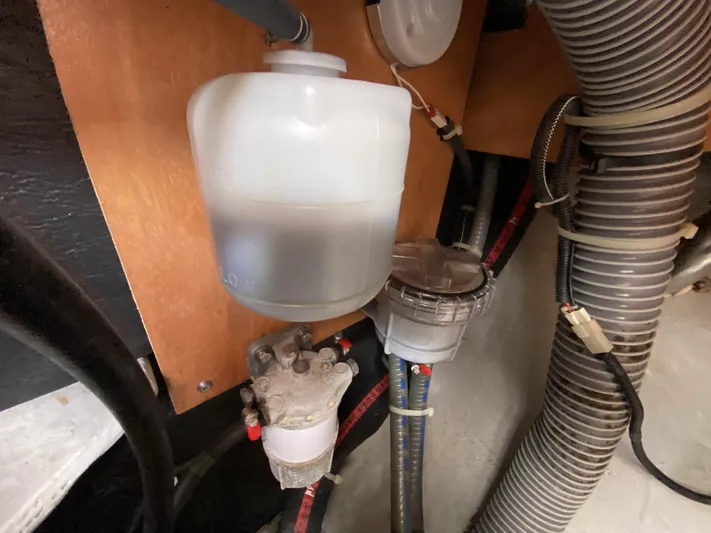 Finally Found Yacht Photos Pics Engine compartment of a 2014 Lagoon 380 S2 with fuel filter and hoses.