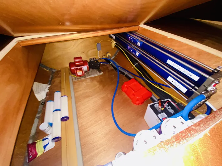 Finally Found Yacht Photos Pics Interior view of a 2014 Lagoon 380 S2 yacht's storage compartment with equipment and wiring.