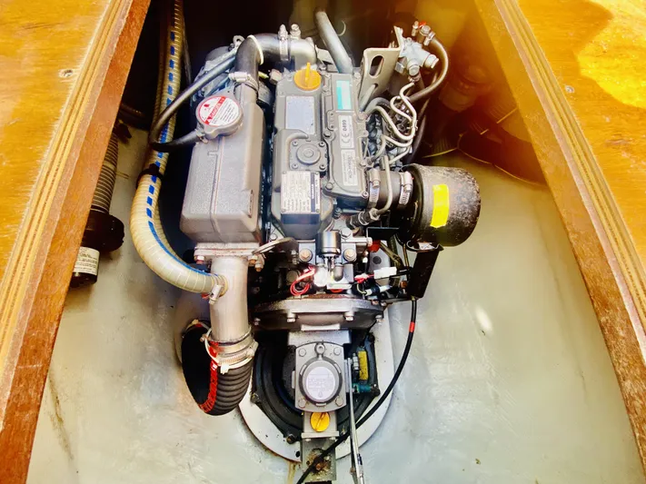 Finally Found Yacht Photos Pics Engine compartment of a 2014 Lagoon 380 S2 catamaran, showcasing detailed mechanical components.