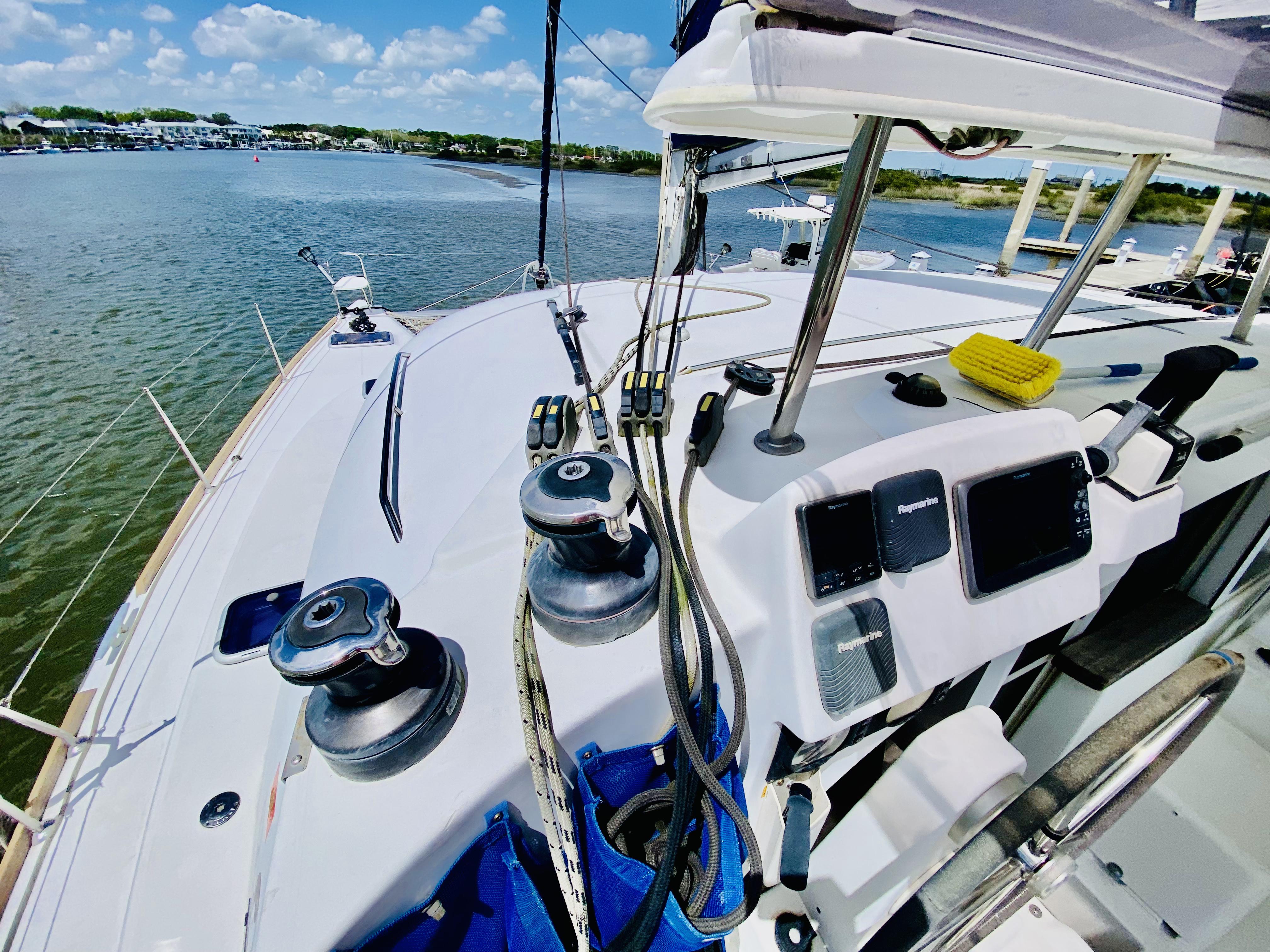 Cockpit view of 2014 Lagoon 380 S2 catamaran with winches and navigation equipment.