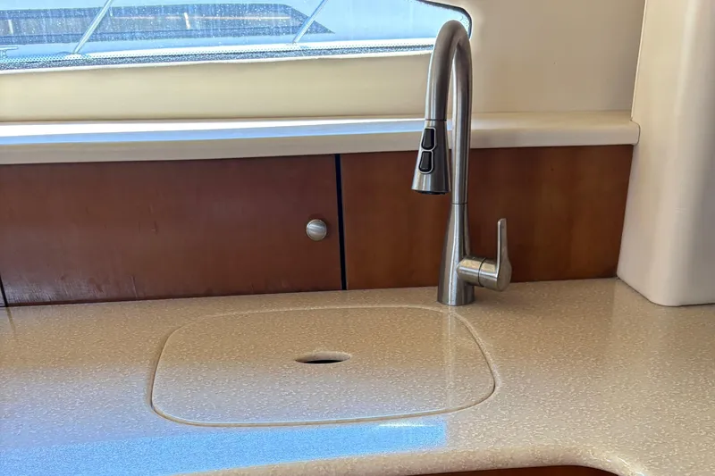  Yacht Photos Pics Modern kitchen sink and faucet in 2005 Meridian 368 Motoryacht interior.