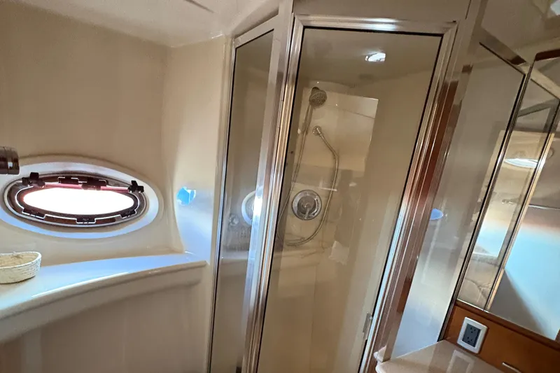  Yacht Photos Pics Luxurious bathroom in 2005 Meridian 368 Motoryacht with shower and porthole window.