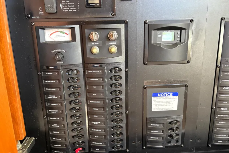  Yacht Photos Pics Electrical control panel of a 2005 Meridian 368 Motoryacht, featuring switches and monitors.