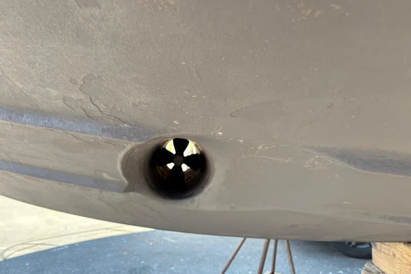  Yacht Photos Pics Close-up of a 2005 Meridian 368 Motoryacht hull with a visible thruster.