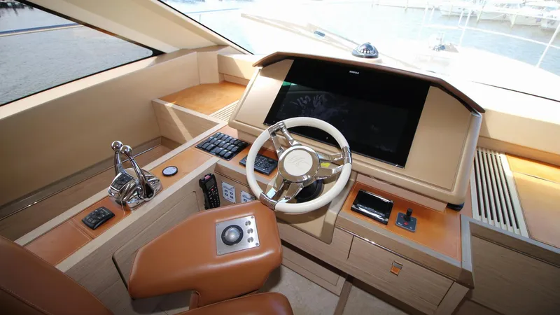  Yacht Photos Pics Helm of 2015 Beneteau Monte Carlo 6 yacht with modern controls and steering wheel.