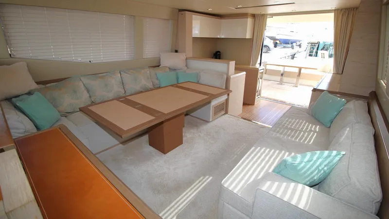  Yacht Photos Pics Luxurious interior of 2015 Beneteau Monte Carlo 6 yacht with spacious seating and elegant decor.