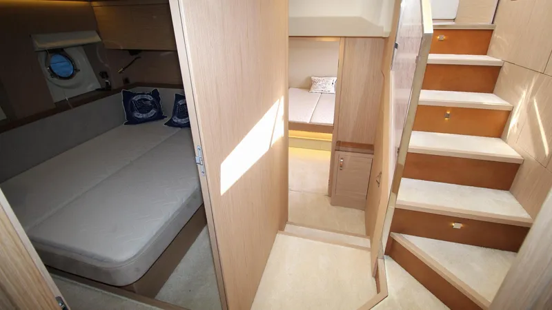  Yacht Photos Pics Luxurious interior of 2015 Beneteau Monte Carlo 6 yacht with cozy cabins and elegant stairs.