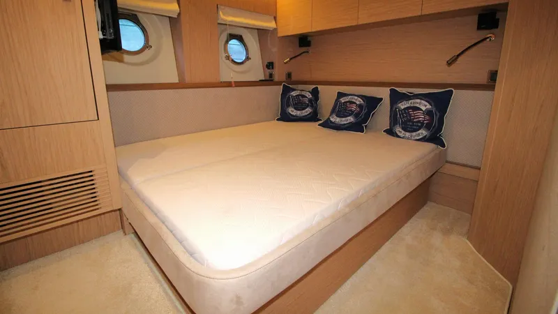 Yacht Photos Pics Luxurious cabin interior of 2015 Beneteau Monte Carlo 6 yacht with cozy bedding.