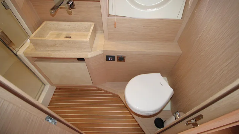  Yacht Photos Pics Luxurious bathroom in 2015 Beneteau Monte Carlo 6 yacht with modern fixtures.