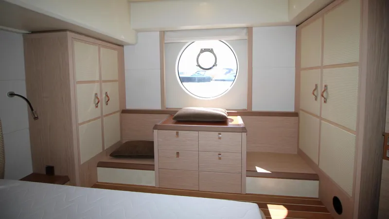  Yacht Photos Pics Luxurious interior of 2015 Beneteau Monte Carlo 6 yacht with elegant wood finish.