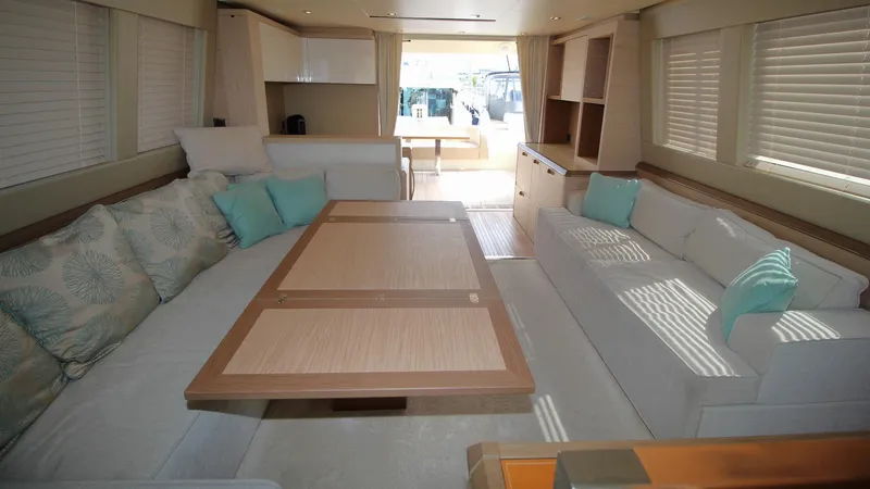  Yacht Photos Pics Luxurious interior of 2015 Beneteau Monte Carlo 6 yacht with elegant seating and modern decor.
