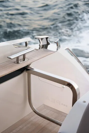 2023 Pearl 62 Luxury Yacht Yacht Photos Pics 2023 Pearl 62 yacht detail with sleek railing and ocean backdrop.