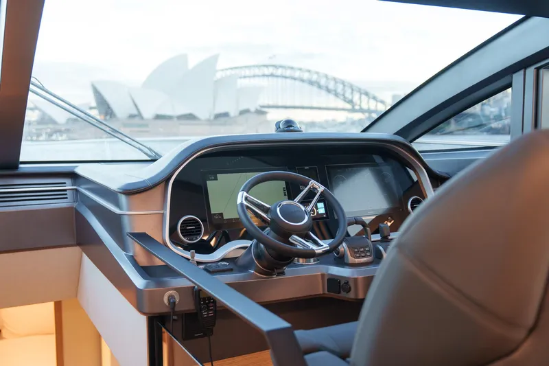 2023 Pearl 62 Luxury Yacht Yacht Photos Pics Helm of 2023 Pearl 62 yacht with Sydney Opera House and Harbour Bridge view.