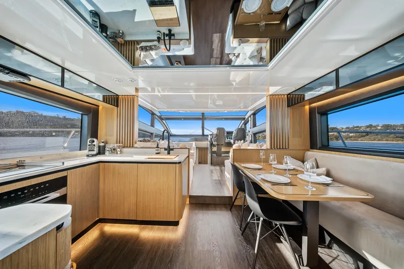 2023 Pearl 62 Luxury Yacht Yacht Photos Pics Luxurious interior of 2023 Pearl 62 yacht with modern kitchen and dining area.