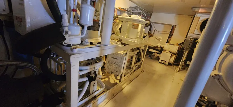  Yacht Photos Pics Engine room of a 2004 Viking 52 Convertible yacht with mechanical equipment.