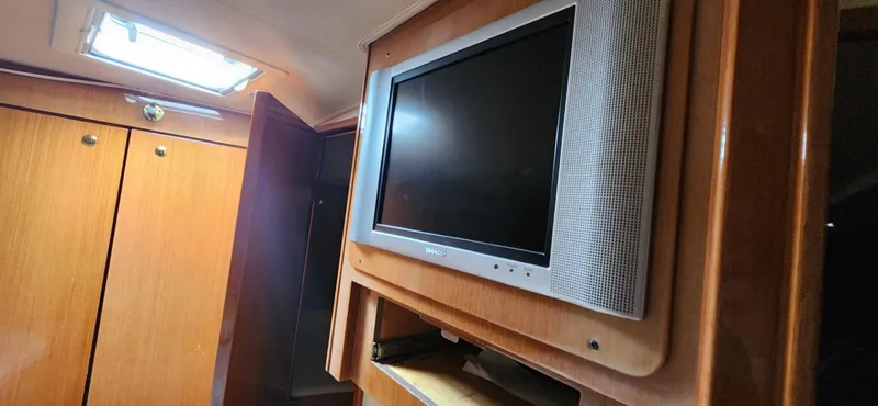  Yacht Photos Pics Flat-screen TV in the cabin of a 2004 Viking 52 Convertible yacht.