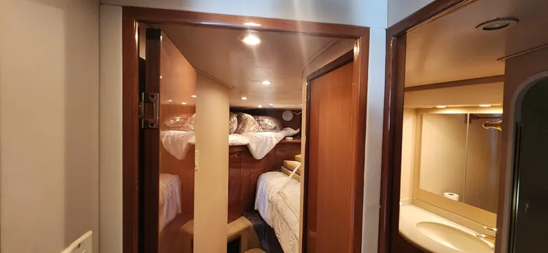  Yacht Photos Pics Interior cabin of 2004 Viking 52 Convertible yacht with bunk beds and bathroom.