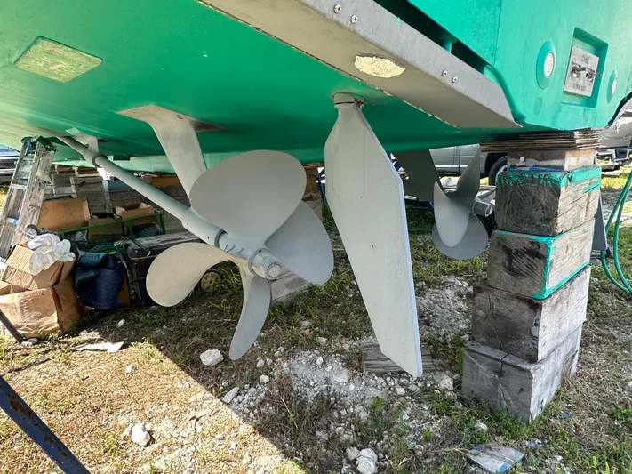  Yacht Photos Pics Close-up of propellers and rudders on a 2004 Viking 52 Convertible boat.