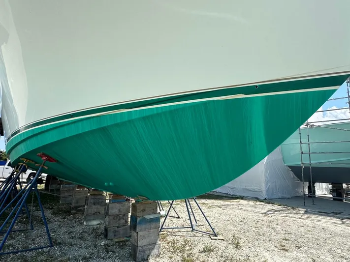  Yacht Photos Pics 2004 Viking 52 Convertible boat hull on stands for maintenance.