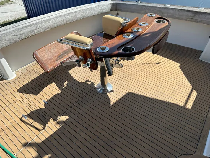  Yacht Photos Pics 2004 Viking 52 Convertible fishing chair on teak deck.