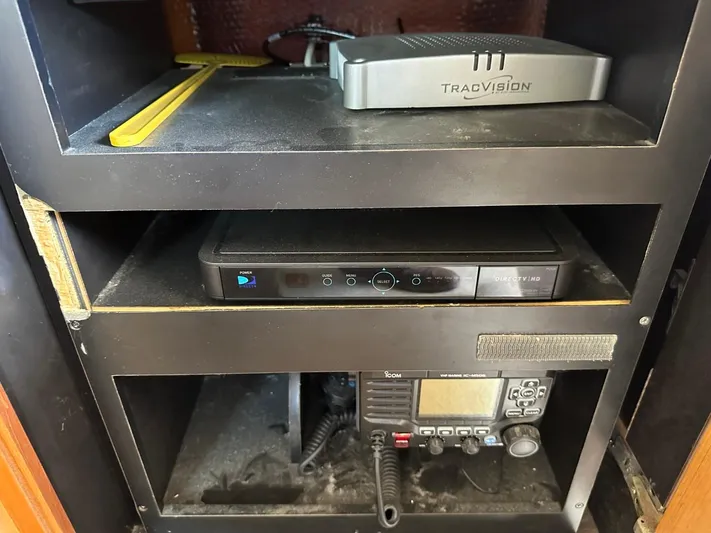  Yacht Photos Pics Electronics shelf on a 2004 Viking 52 Convertible boat with TracVision and communication devices.