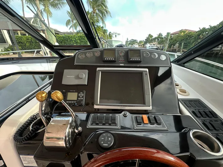  Yacht Photos Pics 2005 Tiara Yachts 3600 Sovran helm with navigation controls and display.