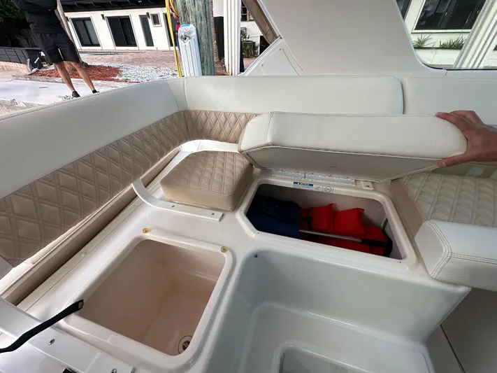  Yacht Photos Pics 2005 Tiara Yachts 3600 Sovran interior storage with cushioned seating and life jackets.