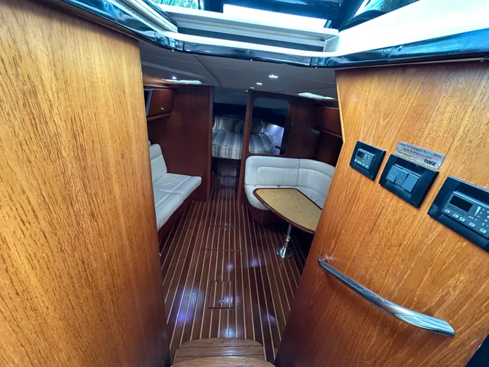  Yacht Photos Pics Interior of 2005 Tiara Yachts 3600 Sovran with wood paneling and plush seating.