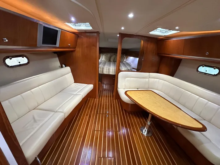  Yacht Photos Pics Luxurious 2005 Tiara Yachts 3600 Sovran interior with elegant wood finish and plush seating.