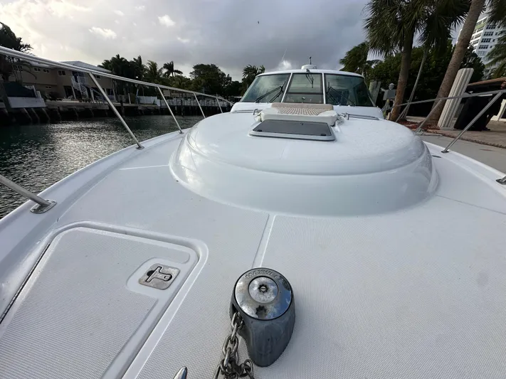  Yacht Photos Pics 2005 Tiara Yachts 3600 Sovran on calm water, showcasing sleek deck design.