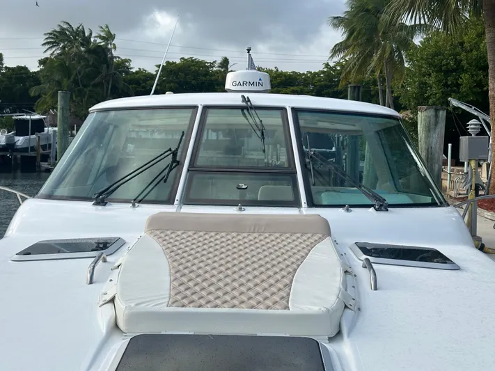  Yacht Photos Pics 2005 Tiara Yachts 3600 Sovran with Garmin equipment, docked near palm trees.