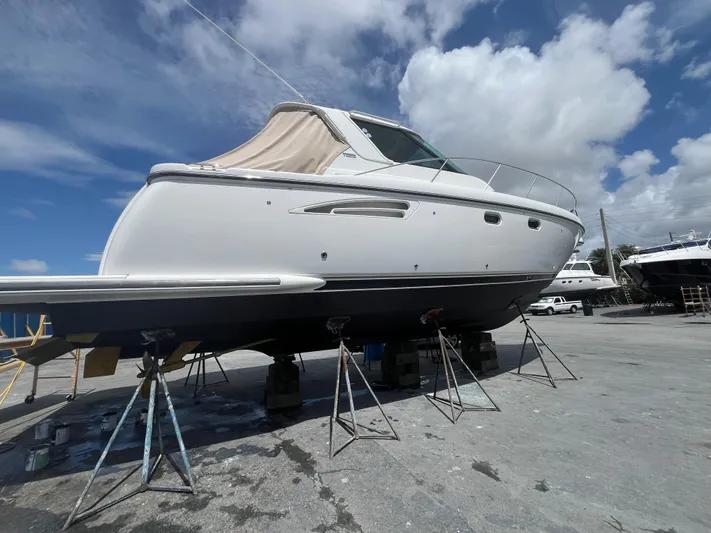  Yacht Photos Pics 2005 Tiara Yachts 3600 Sovran on dry dock under a clear blue sky.