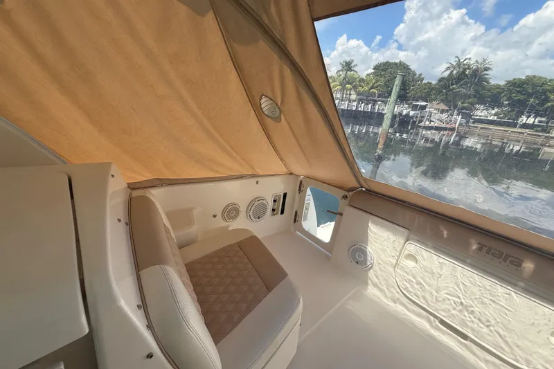  Yacht Photos Pics 2005 Tiara Yachts 3600 Sovran interior with beige seating and marina view.