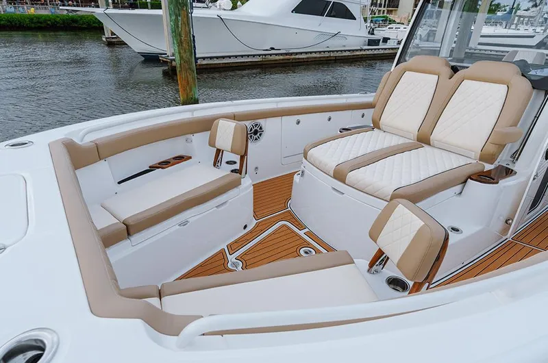  Yacht Photos Pics Manufacturer Provided Image: 2025 Everglades 315 Center Console boat with luxurious seating and teak flooring.