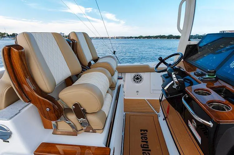  Yacht Photos Pics Manufacturer Provided Image: 2025 Everglades 315 Center Console boat interior with luxurious seating and advanced dashboard.