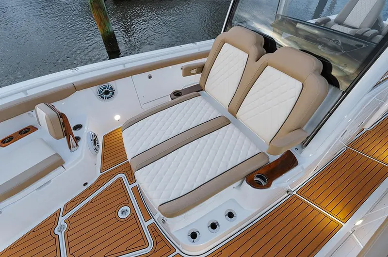  Yacht Photos Pics Manufacturer Provided Image: 2025 Everglades 315 Center Console boat with luxurious seating and teak flooring.
