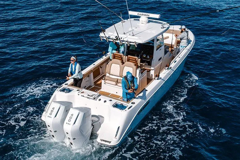  Yacht Photos Pics Manufacturer Provided Image: 2025 Everglades 315 Center Console boat on open water, featuring dual engines.