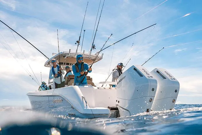 Yacht Photos Pics Manufacturer Provided Image: 2025 Everglades 315 Center Console boat with anglers fishing in open water.