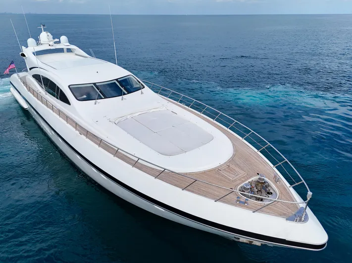  Yacht Photos Pics Luxury 2002 Mangusta 108 yacht cruising on open sea, sleek design, elegant deck.