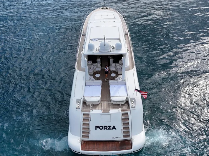  Yacht Photos Pics Luxury 2002 Mangusta 108 yacht "Forza" cruising on open water.